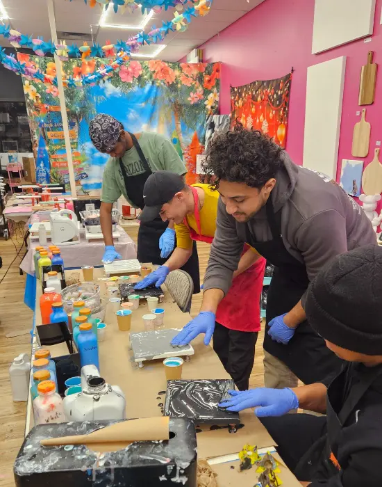 Guests enjoying a resin art workshop at Hangout for Art creative studio in Allentown
